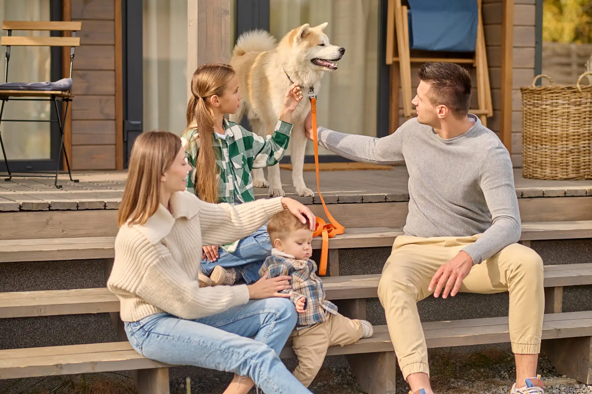 Family enjoying a holiday with their dog
