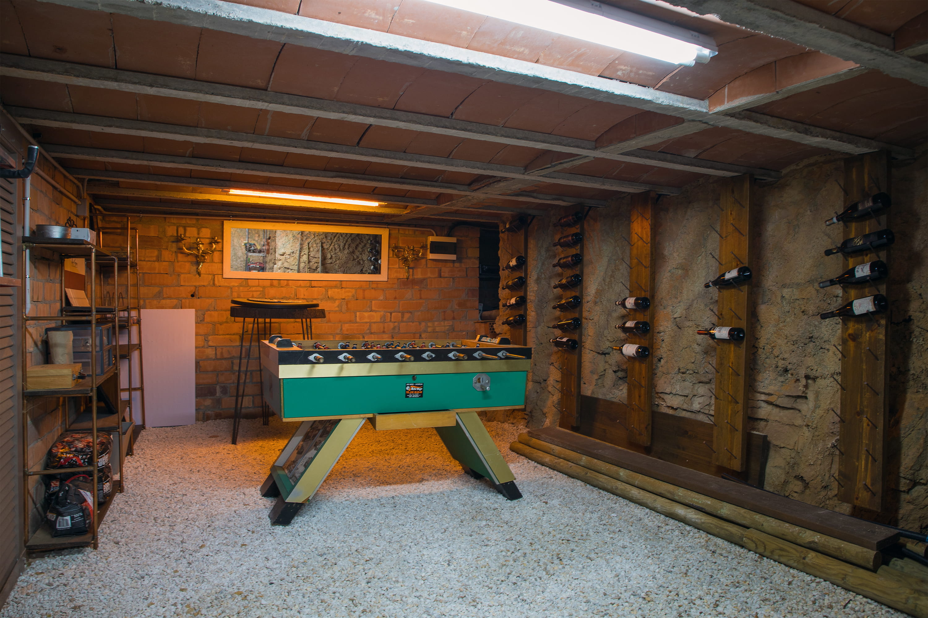 Bodega with wine racks and football table
